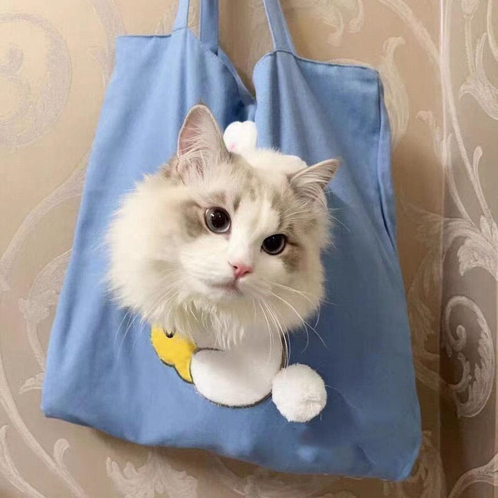 Cute plush toy peeking out pet bag