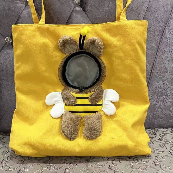 Cute plush toy peeking out pet bag