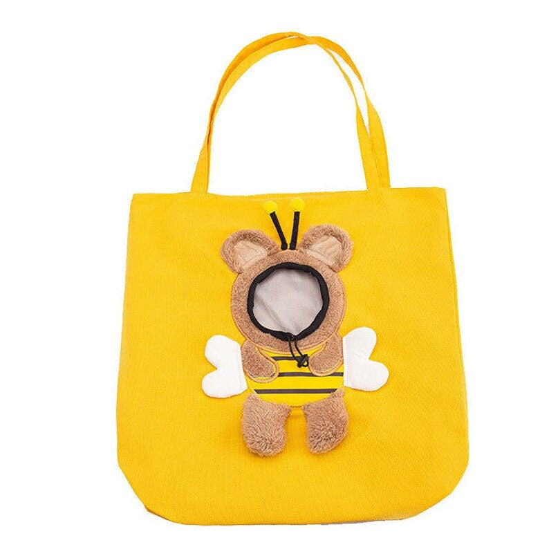 Cute plush toy peeking out pet bag