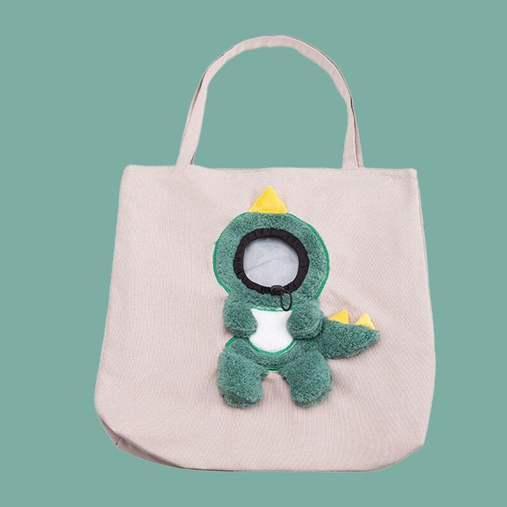 Cute plush toy peeking out pet bag