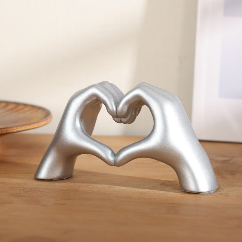 Heart-shaped hand ornament