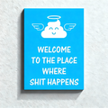 Fun bathroom wall art—"Angelic Shit: Welcome to the Place"